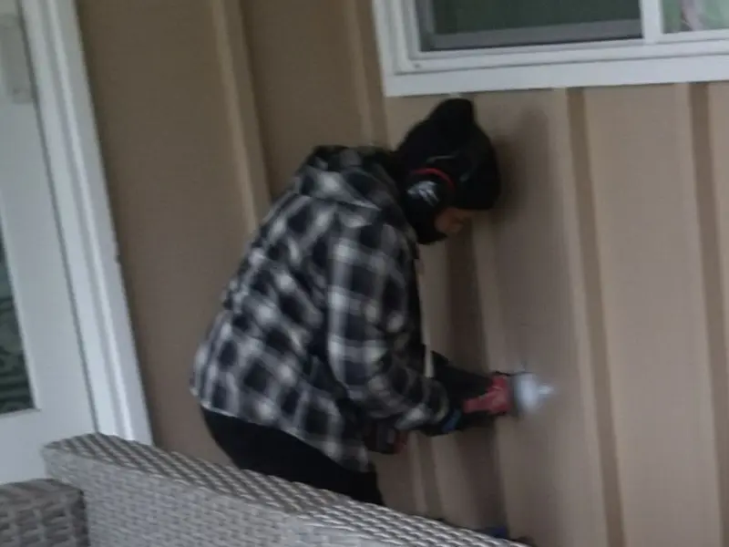 Professional electrician installing an exterior outlet in Madeira
